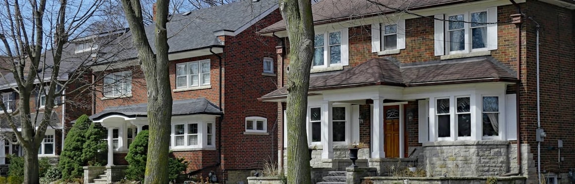 Row Of Stately Brick Homes With Porches Equal Opportunity Neighborhood