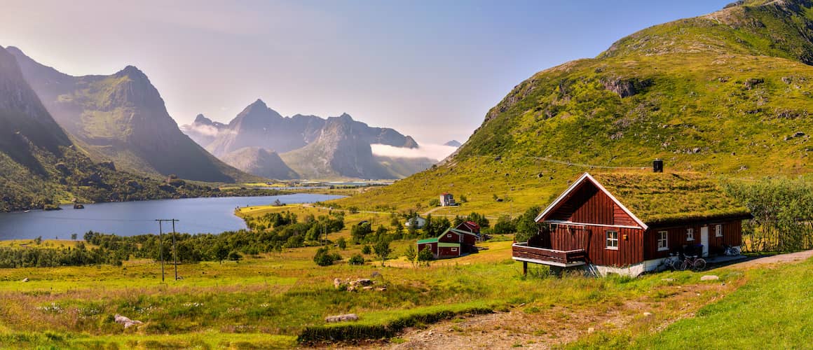 Rural house in field with view of mountains.