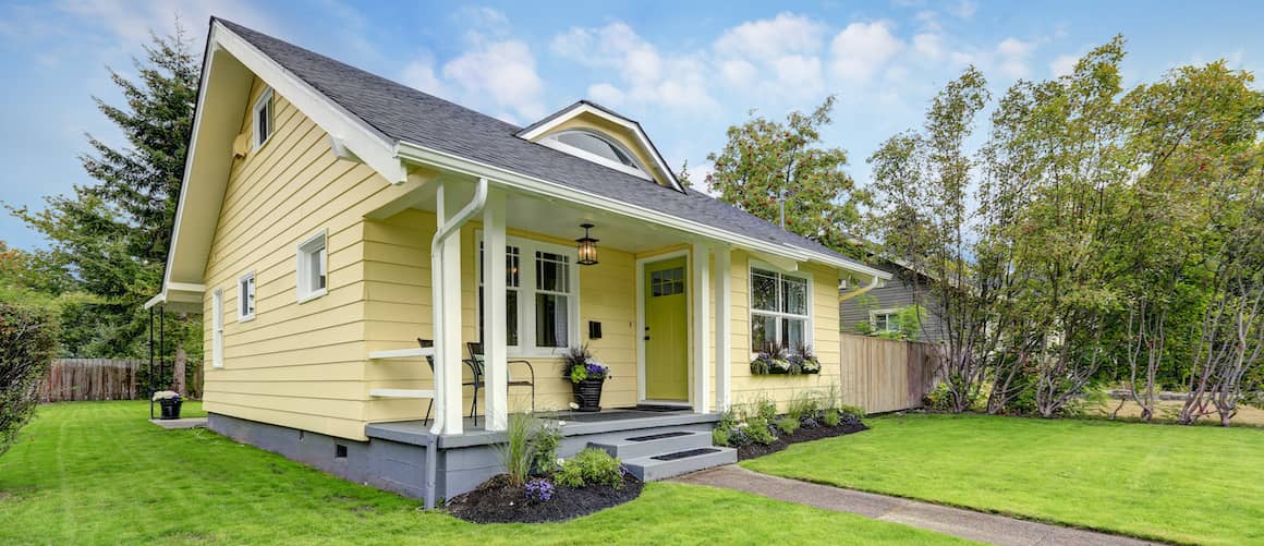 Small yellow suburban American house.