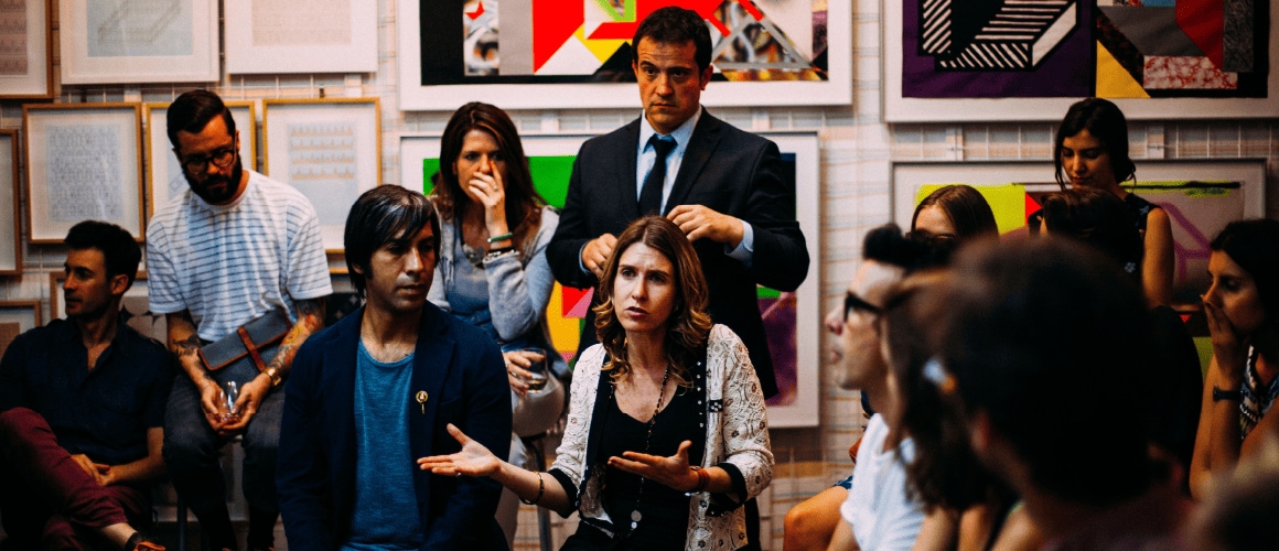 Group of people discussing something together.