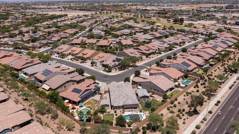 Afternoon aerial view of single family housing neighborhood near downtown Goodyear, Arizona.