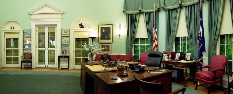 Federal-style interior with oval shapes and muted colors.