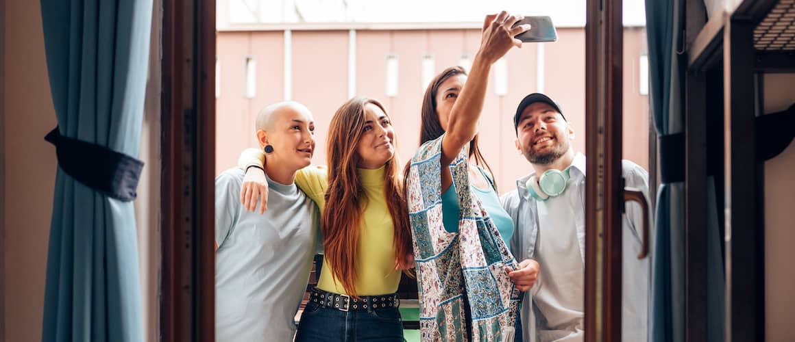 Gen Z friends taking a group selfie.