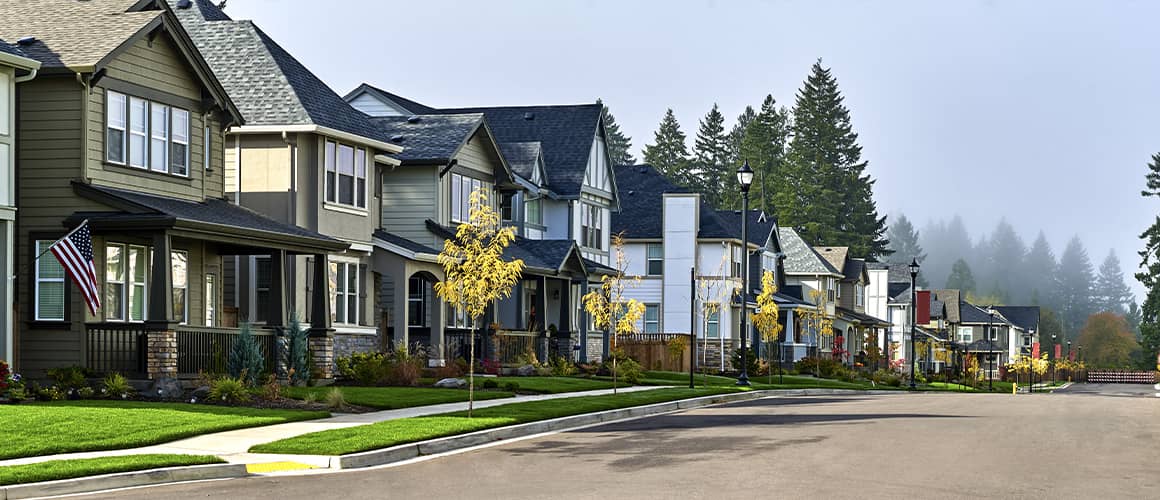 Houses in a row on a suburban street.