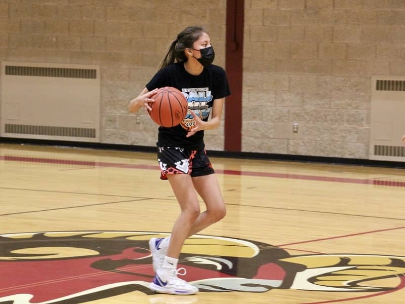 Quiana running on the basketball court.