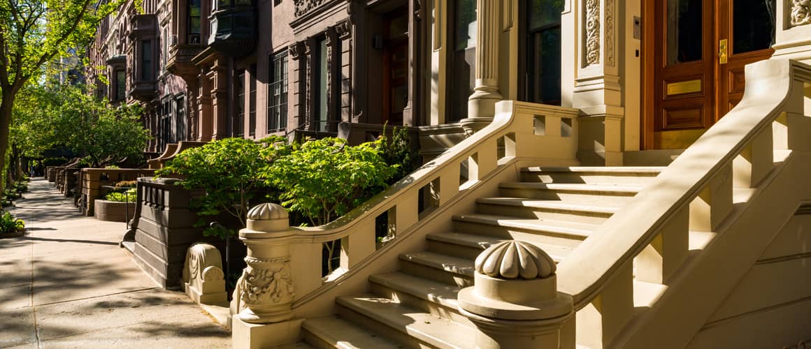 Outdoor steps up to row home.
