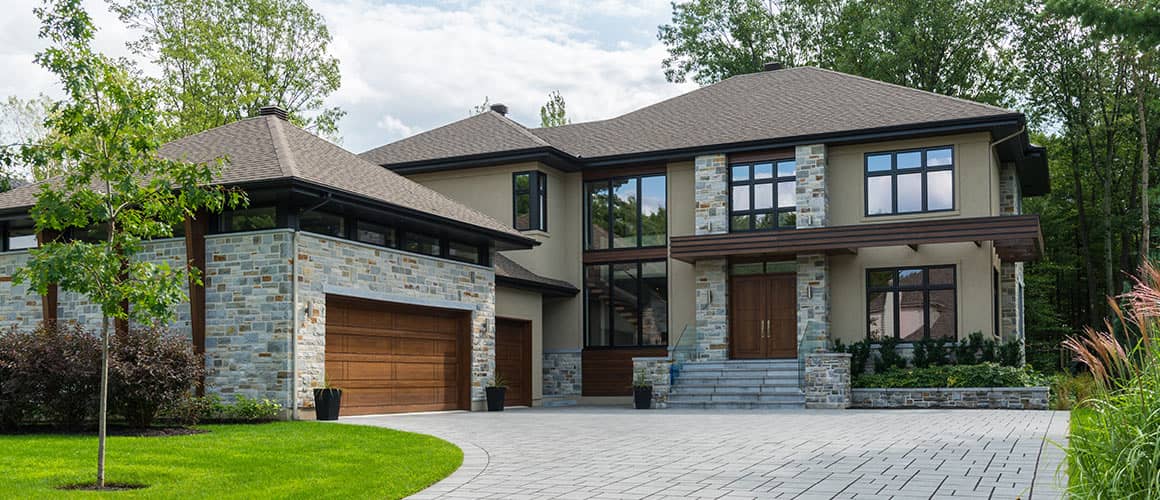 driveway to brown and grey suburban house