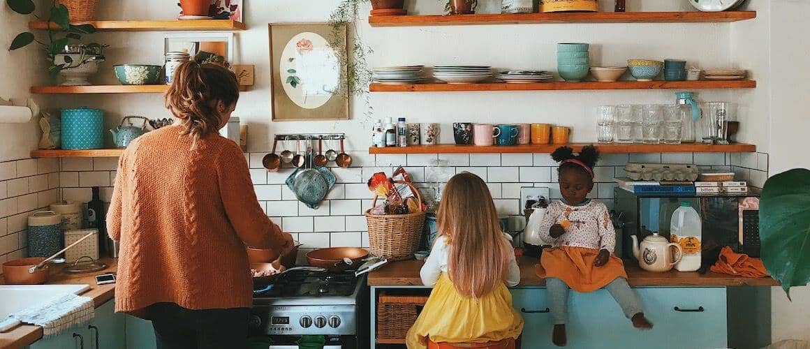 Small, young family in kitchen.
