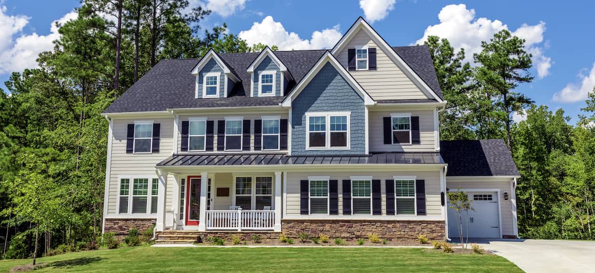 exterior photo of 2 story house in the summer