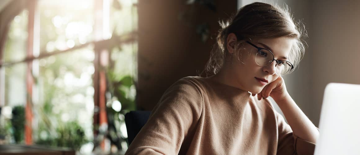 Woman reviewing her mortgage information online in her home.