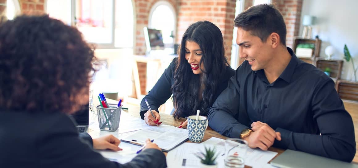 Young Couple Signing for Loan