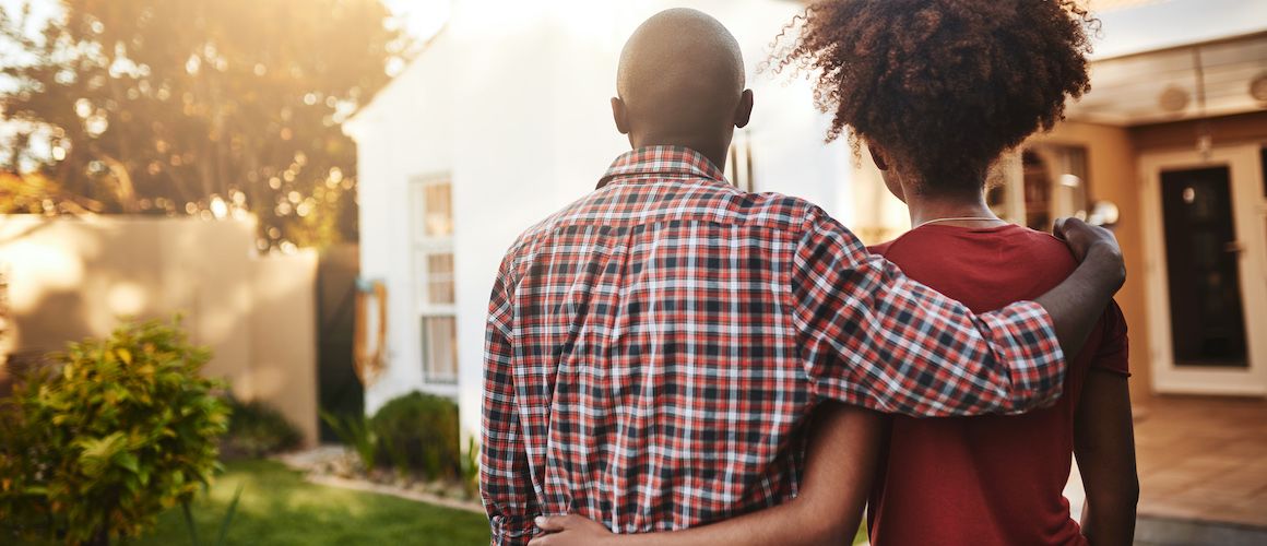 Couple looking at their new house.