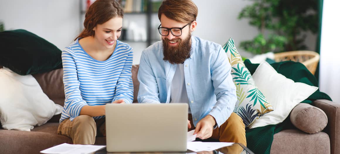 Couple paying mortgage payment online.