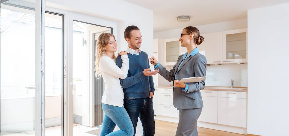 couple getting keys for rental home