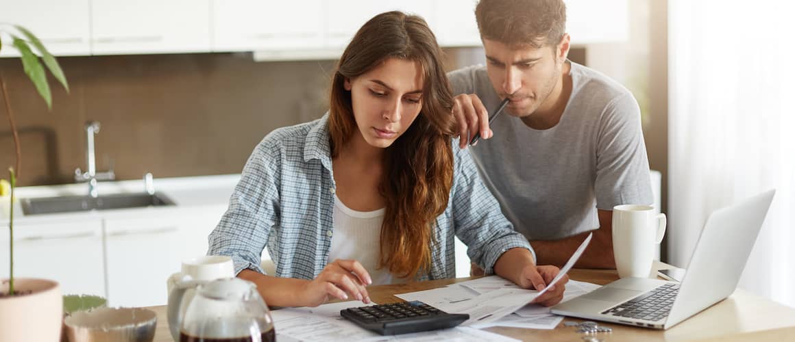 couple sorting through financial documents