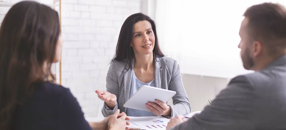 3 people in a financial meeting
