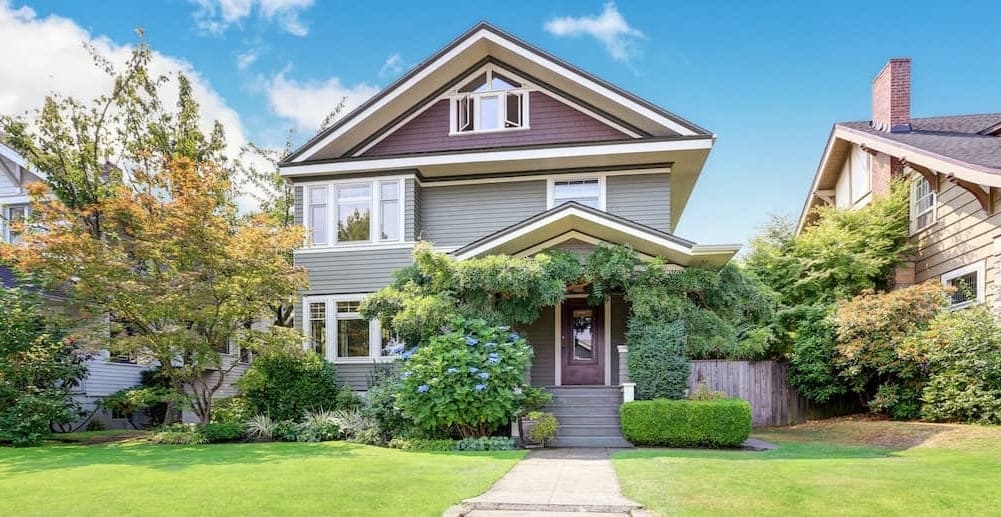 smaller green two-story house