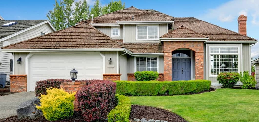 House green grass with bushes
