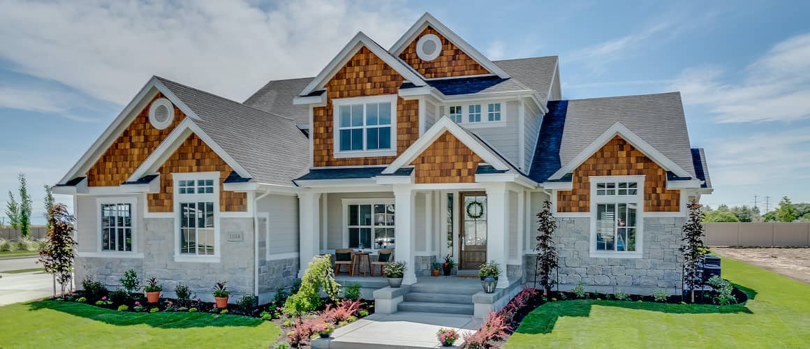 house with walkways and green grass