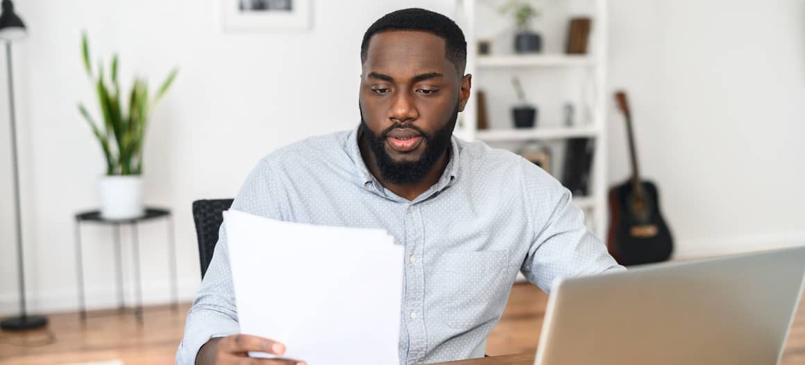 man looking at contact in his home