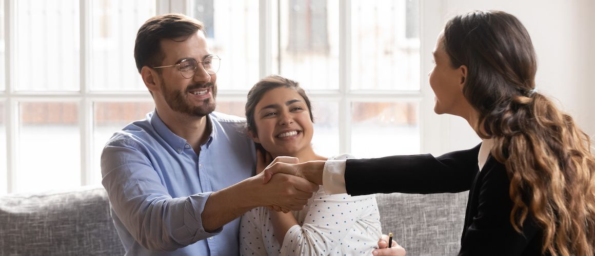 Mortgagor shaking hands with a mortgagee.