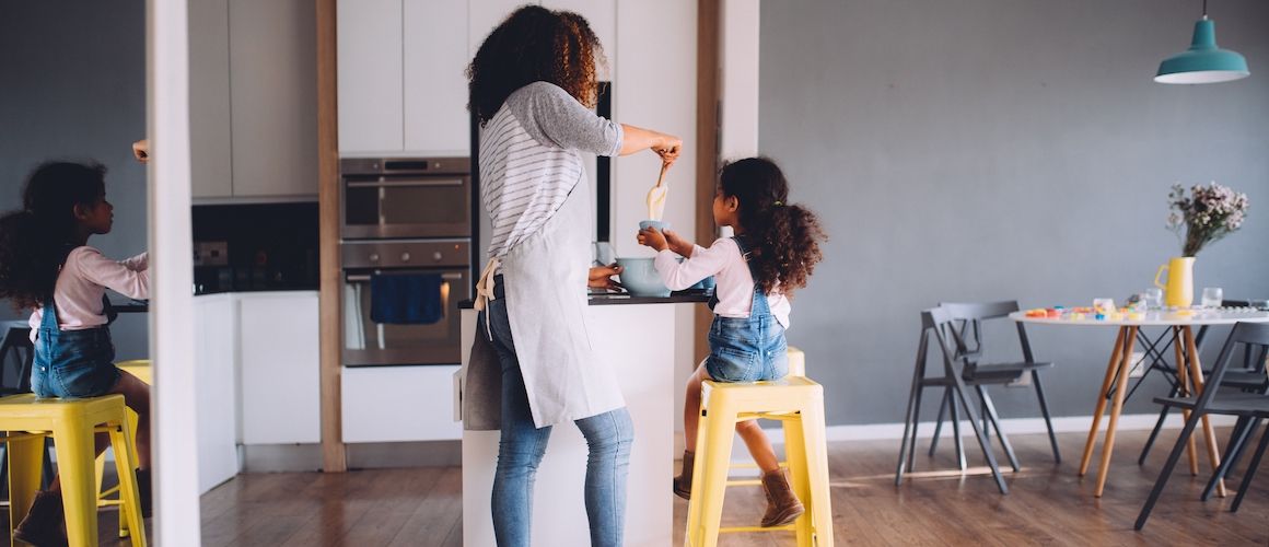 Mother and daughter cooking together.