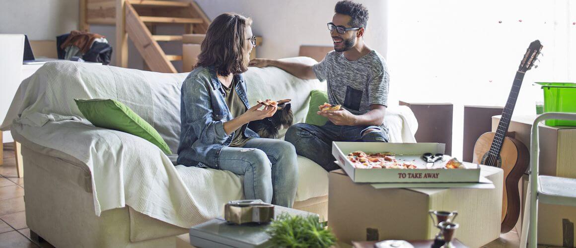 Couple unpacking their first home.