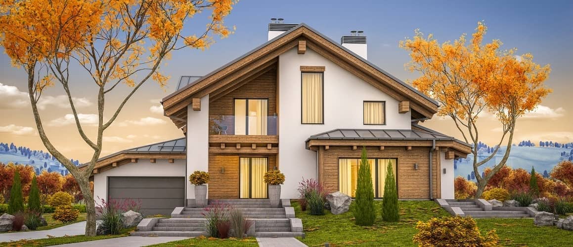 Nice multi-story house against a rolling hill.