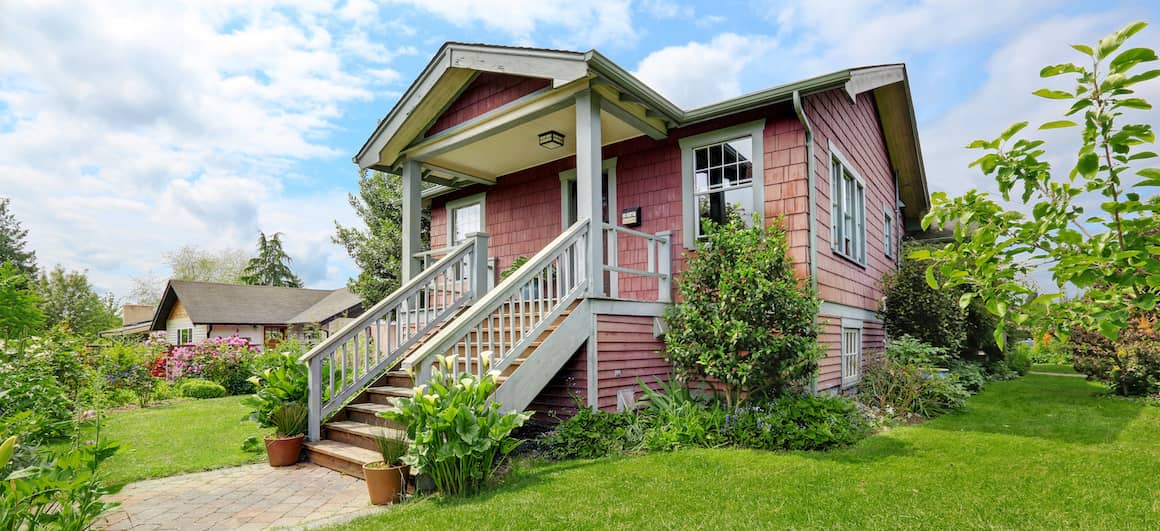 Exterior image of old red house.