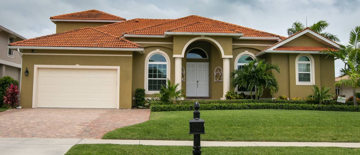 Olive Green Home With Terracotta Roof