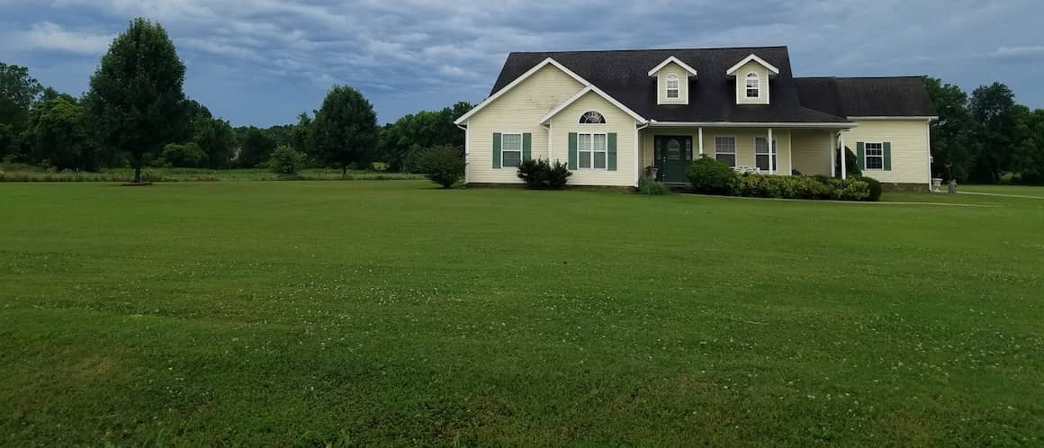 Pale Yellow House In Country