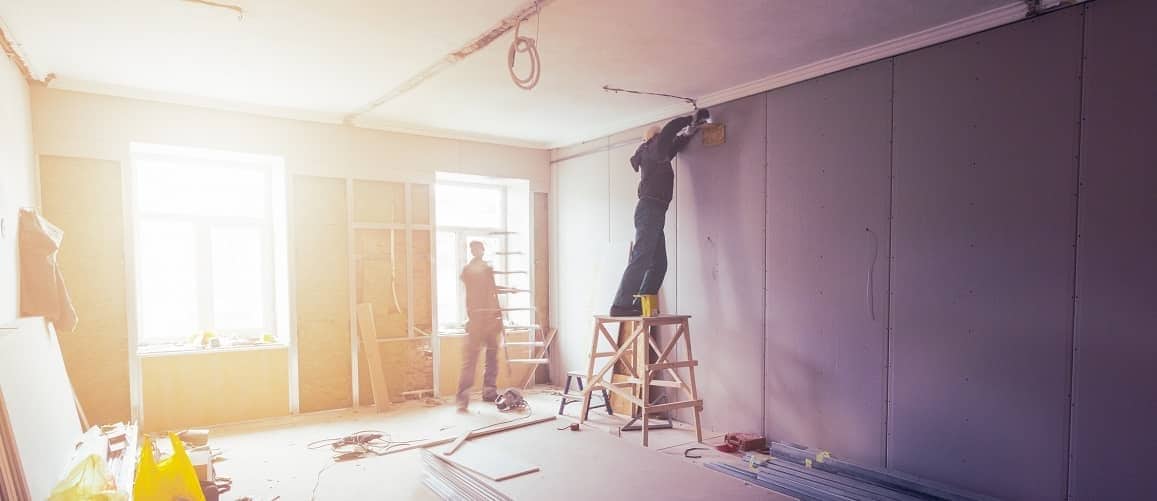 Fixing drywall in a home.