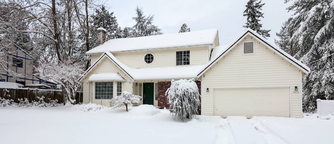 White Two Story Residential Home In Winter