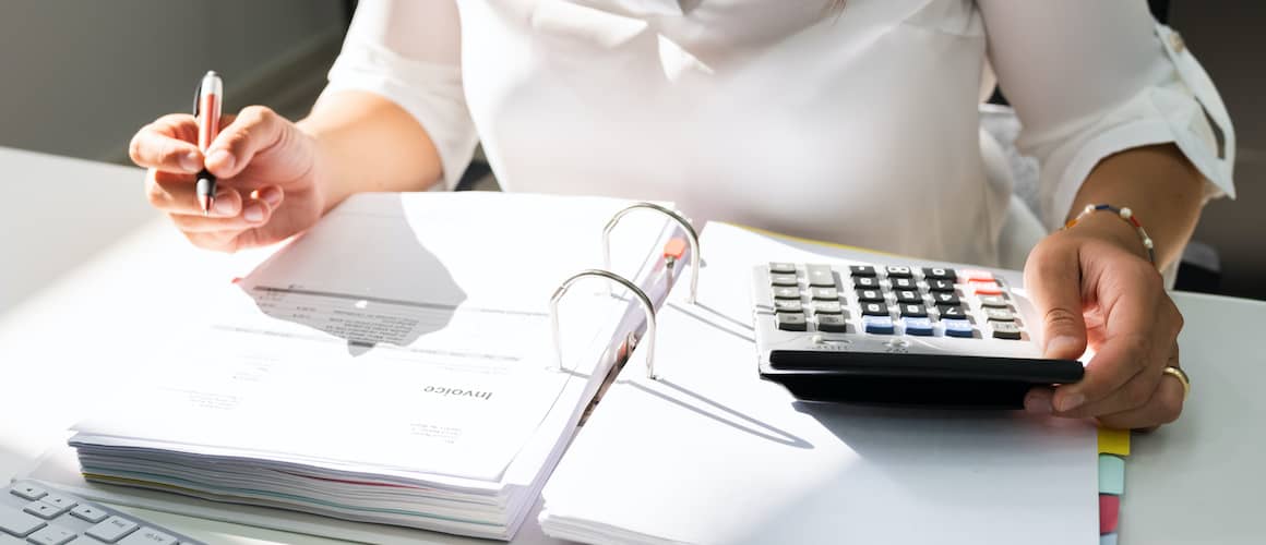 Woman with calculator.