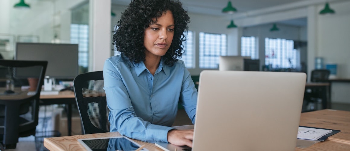 woman in office on laptop