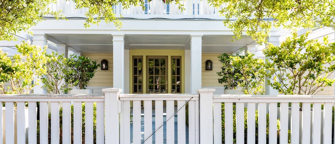 Wood Architecture Of House Door Gate To Front Porch Yard With Green Landscaping