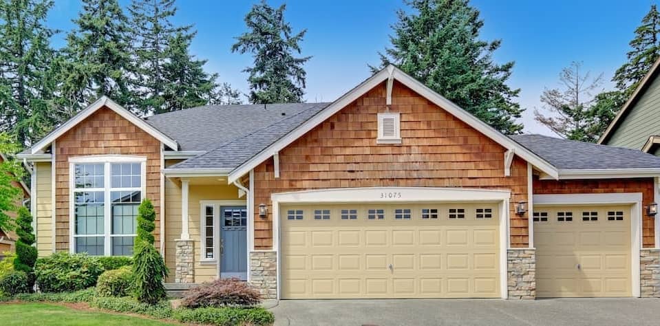 Ranch style house with wood siding.
