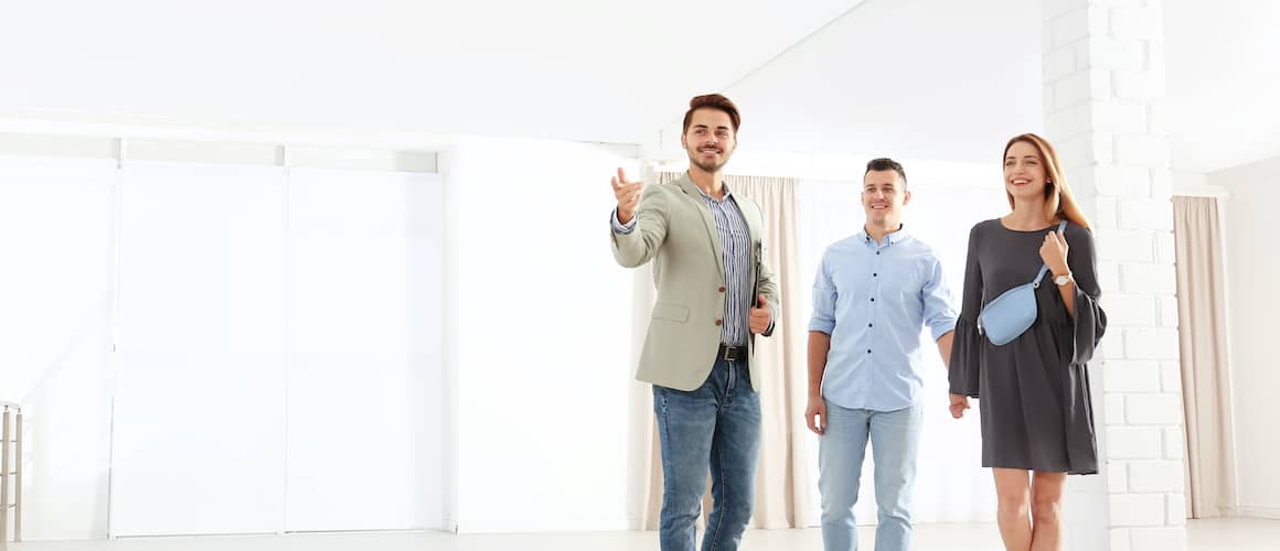 Young couple touring a new home.