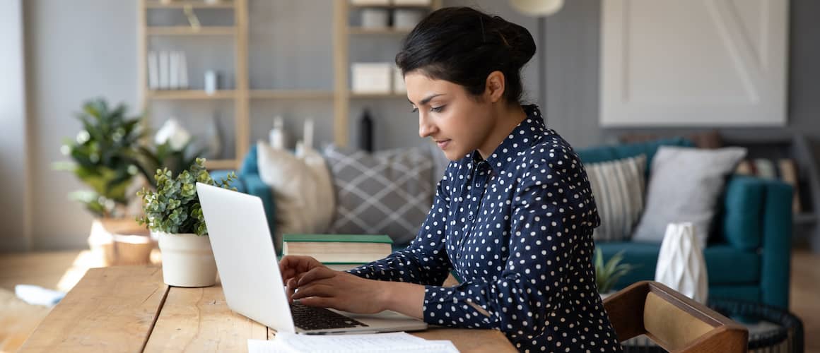 Young Woman Searching On Laptop