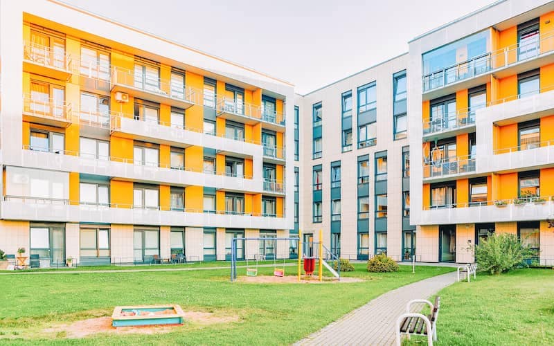Modern orange and white apartment buildings.