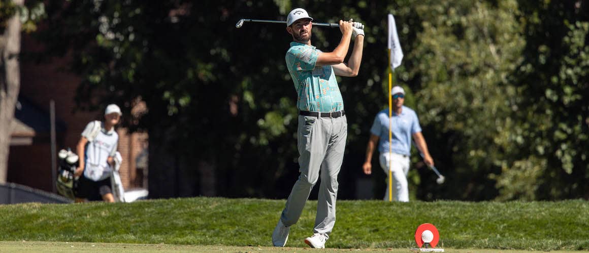 Golfer from Rocket Mortgage's Classic Fan Experience mid swing.