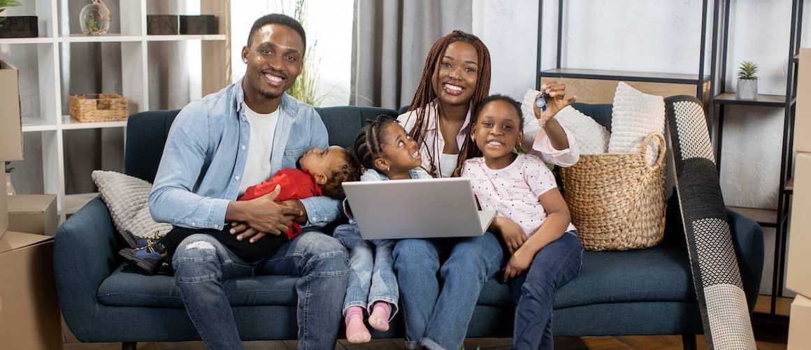 African-American family with new keys.