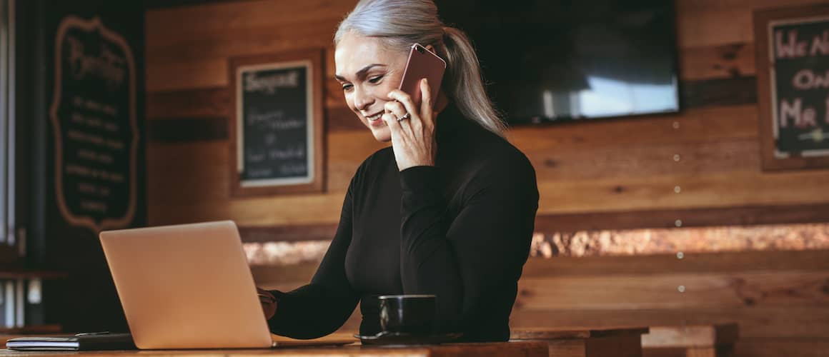 Businesswoman At Cafe Making A Phone Call