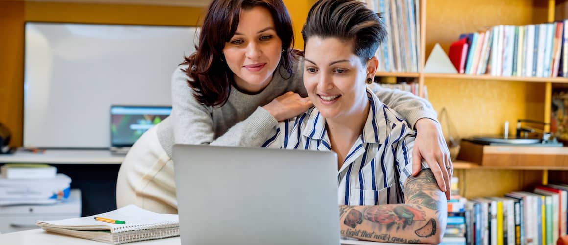 Couple looking at laptop together
