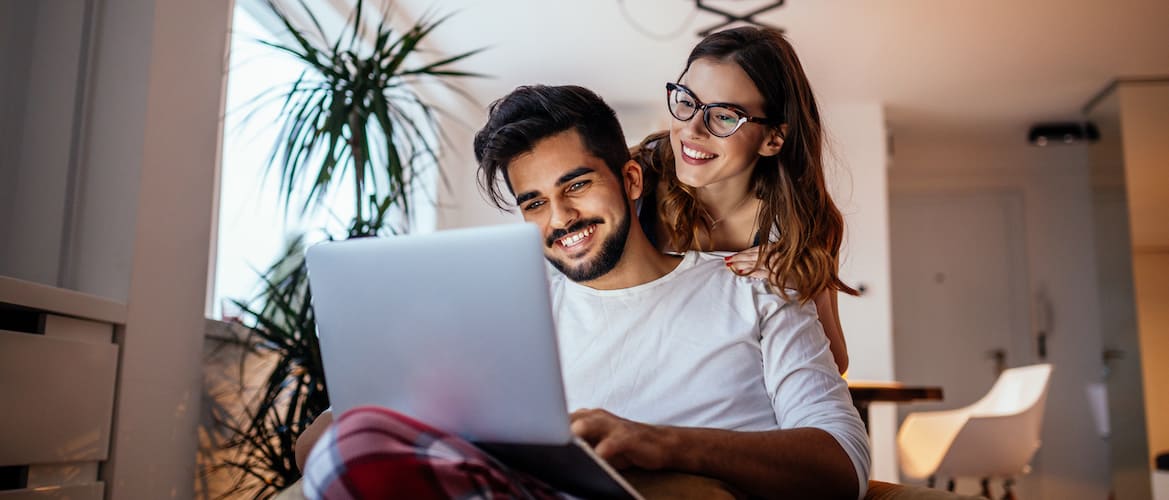 Couple searching for home online