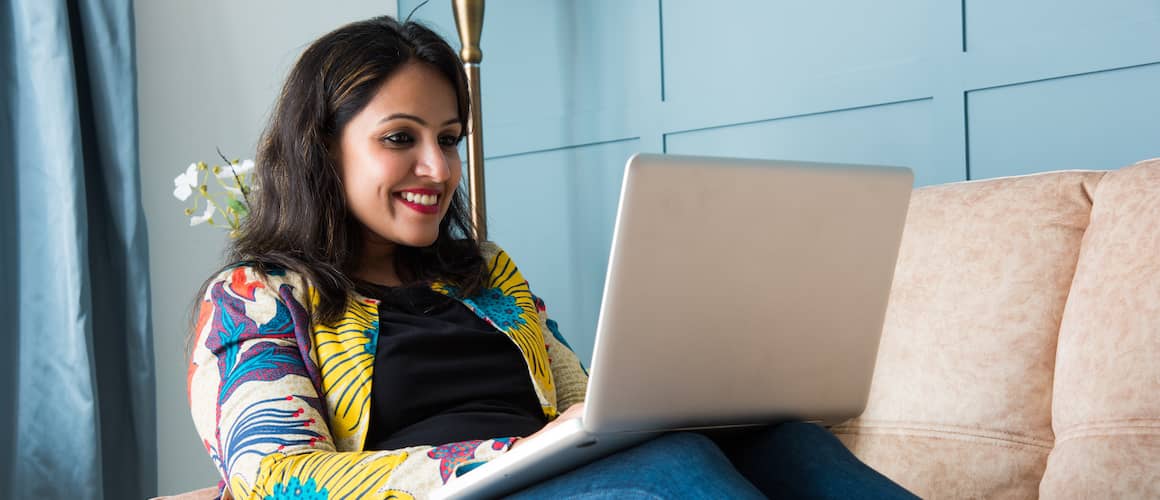 Indian woman on laptop.