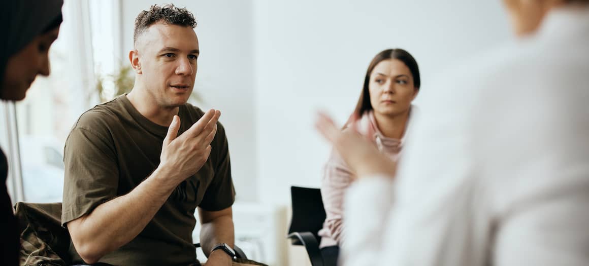 A military man speaking to an advisor.