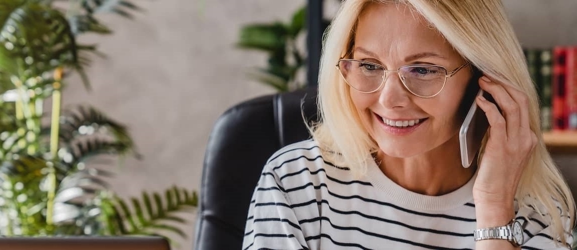 Beautiful Older Woman Figuring Out Her Principal Balance