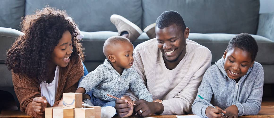 Shot of a family playing together in the lounge at home