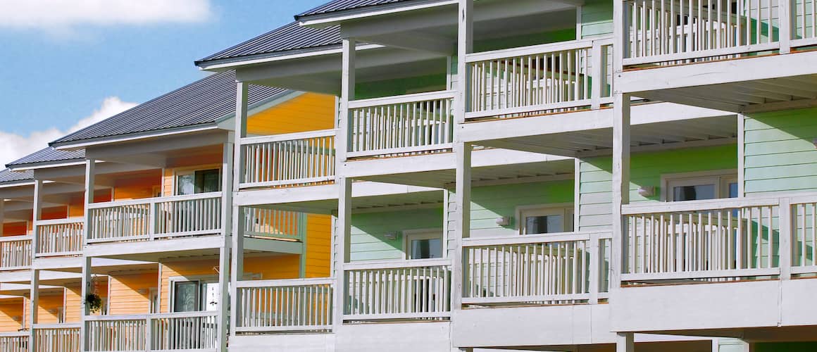Row of tropical colorful Townhomes.